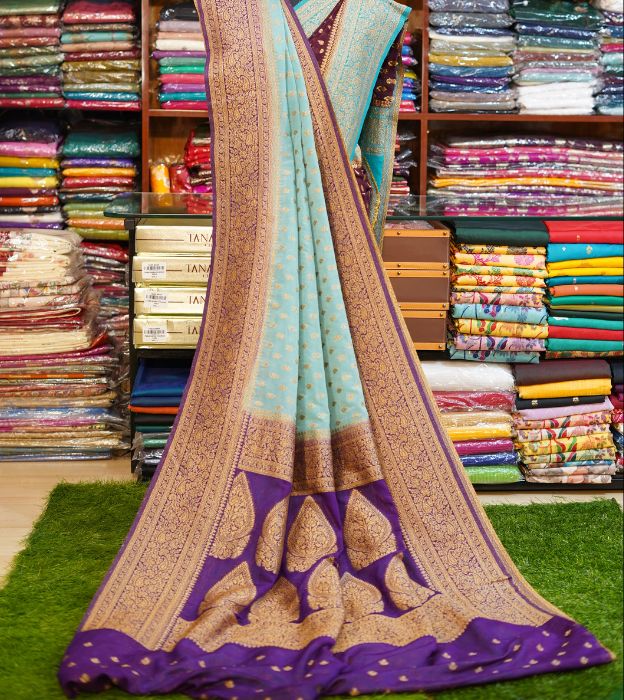Elegant Semi Pure Khaddi Georgette Saree With Contrast Teal Border